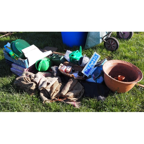 764 - Wheelbarrows, water drums and other garden equipment