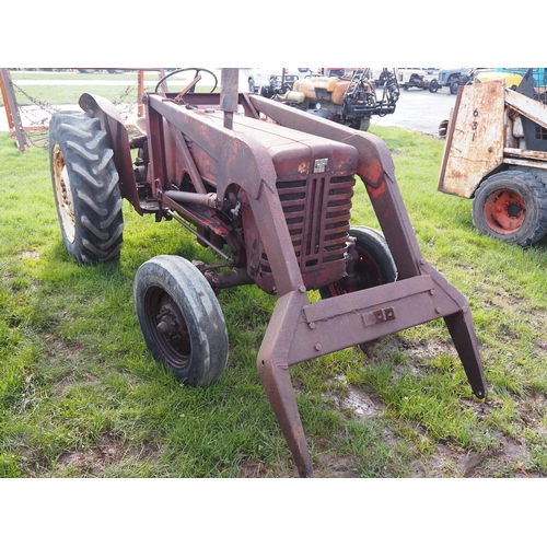 1735 - International B250 tractor. Twin steering arms, fitted with loader. Starts with a pull