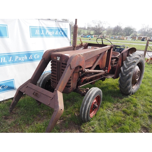 1735 - International B250 tractor. Twin steering arms, fitted with loader. Starts with a pull