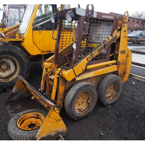 1623 - Case 1818 skid steer with bucket, pallet tines, grab and drawbar. Key in office