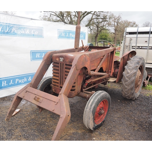 1735 - International B250 tractor. Twin steering arms, fitted with loader. Starts with a pull