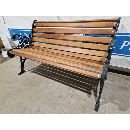 3016 - Hardwood garden bench with ornate cast iron ends, 50