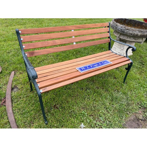 192 - Garden bench made with South American hardwood and cast iron ends 4ft