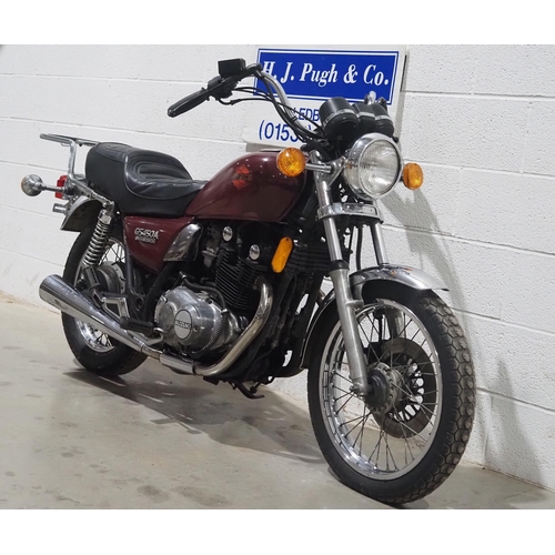 1054 - Suzuki GS450 motorcycle. 
Runs but will require recommissioning. Import. 
Come with Nova document. K... 