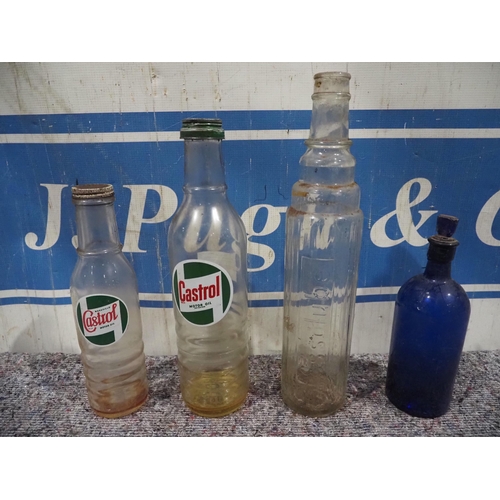 487 - Glass oil bottles to include Castrol and Essolube