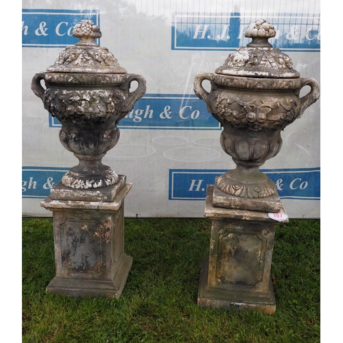 Pair of quality lidded urns on plinths 5 1/2ft