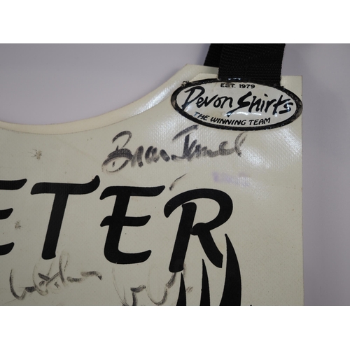 124 - An Exeter Falcons speedway race vest signed by Colin Hill, Mark Simmonds and others