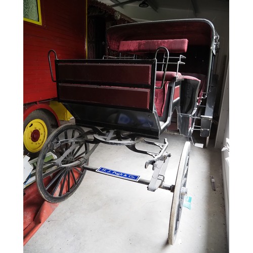 151 - Horse drawn 4 wheeled coach. Red upholstered seats and table