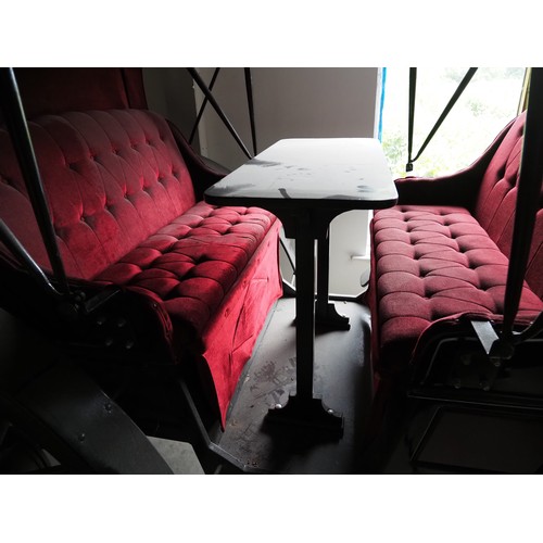 151 - Horse drawn 4 wheeled coach. Red upholstered seats and table