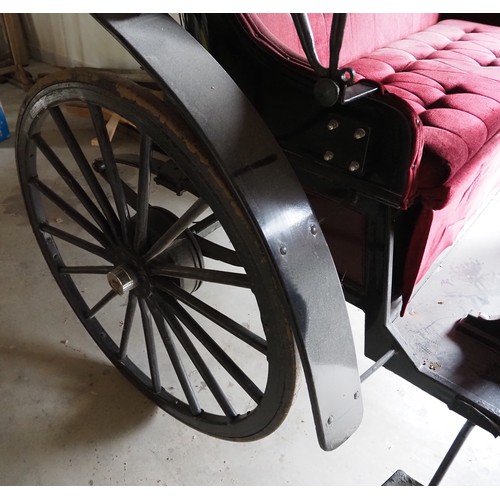 151 - Horse drawn 4 wheeled coach. Red upholstered seats and table