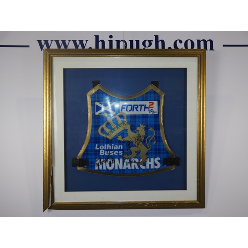 304 - A framed Edinburgh Monarchs speedway race vest featuring various signatures. Damaged frame