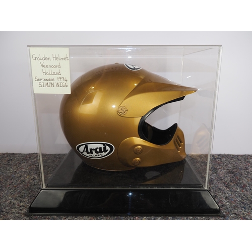 Golden speedway helmet labelled Simon Wigg at Veenoord, Holland in ...