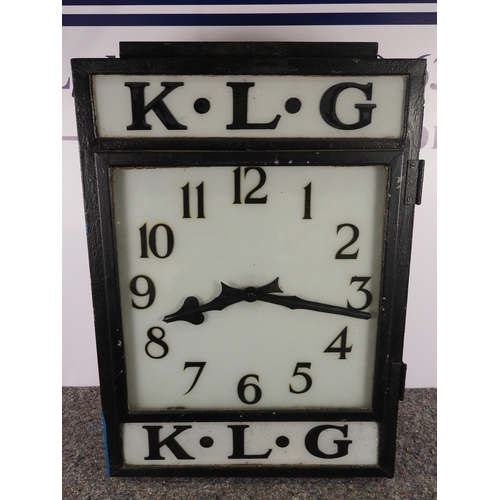 K.L.G Doubled advertising clock 34" x 23". Crack on glass on the side door.