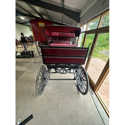 151 - Horse drawn 4 wheeled coach. Red upholstered seats and table