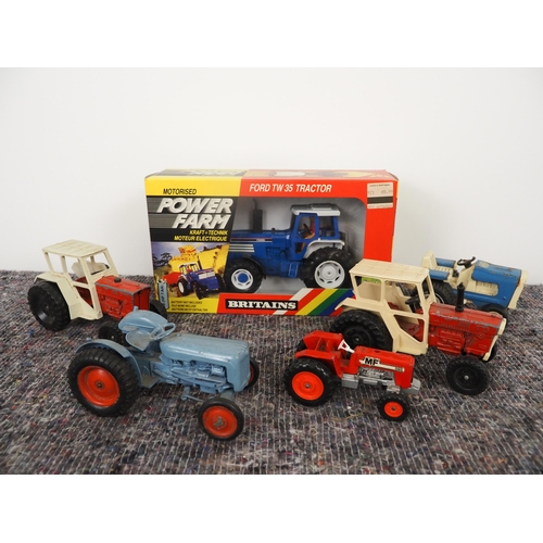 24 - Britains model Ford TW35 tractor and other model tractors to include Crescent, Matchbox and Tonka