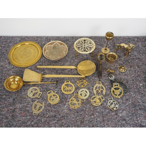 283 - Quantity of brass items to include horse brasses, plates, trivet, etc.