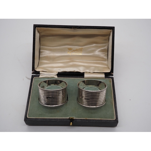 321 - Pair of silver napkin rings in presentation box