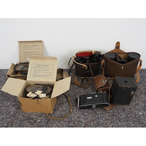 271 - WWII civilian respirator gas masks, binoculars and cameras