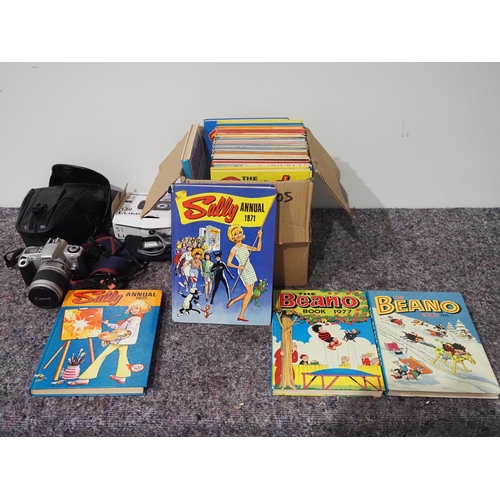 219 - Quantity of 1970s annuals and Lumix and Canon cameras