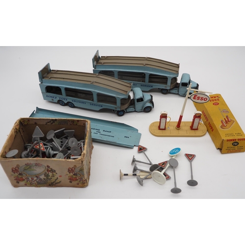 83 - Dinky Toys delivery service model lorries, Dinky petrol pump and assorted model road signs