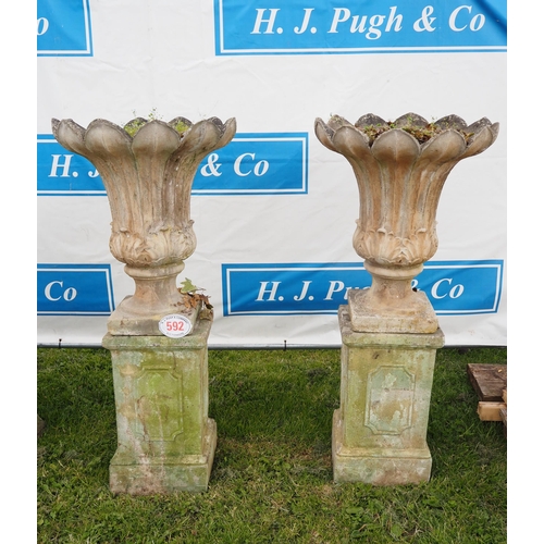592 - Pair of Urns on plinths 5ft