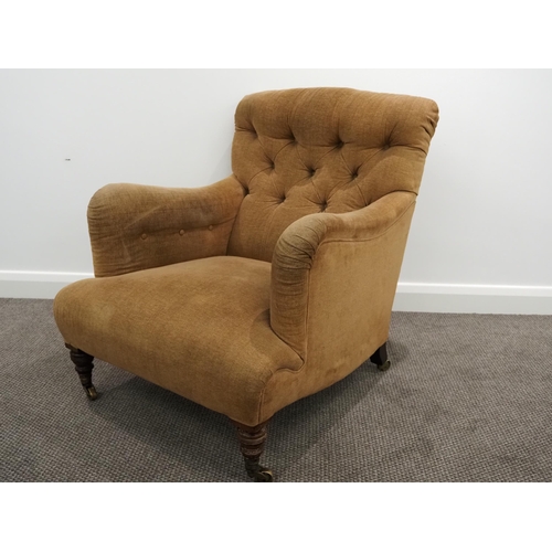Howard & Sons Ltd armchair. Sat on turned mahogany legs with stamped brass castors. This armchair has been within the same family for 3 generations and was originally owned by the vendor's grandfather Sir Eric Maclagan, director of the Victoria and Albert Museum from 1924-1945.
This chair has been reupholstered to a standard of the highest quality in traditional methods using horsehair and has been covered in Wemyss cotton velvet by Rupert Boulting Furniture of Eynsham, Oxfordshire.