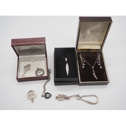 332 - Silver golfing pendant, necklace with earrings set and various other pendants