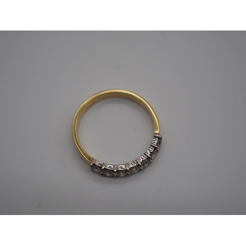 345A - 18ct Yellow/white gold 7 stone half eternity ring. All stones are 10 points. 4.5g