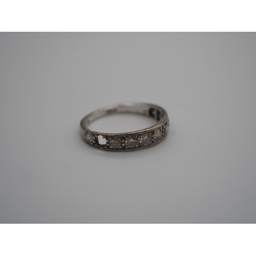 345B - 18ct White gold 9 stone graduated half eternity ring. The largest approx. 20 points. 3.5g