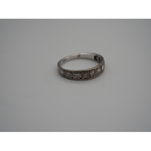 345B - 18ct White gold 9 stone graduated half eternity ring. The largest approx. 20 points. 3.5g