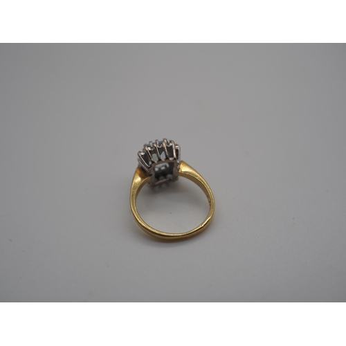 347 - 18ct Yellow gold claw set cluster ring set with central aquamarine surrounded by small diamonds. 4.4... 