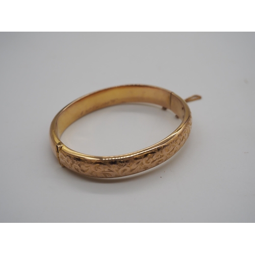 348C - 9ct Hallmarked hollow hinged bangle. 14.7g