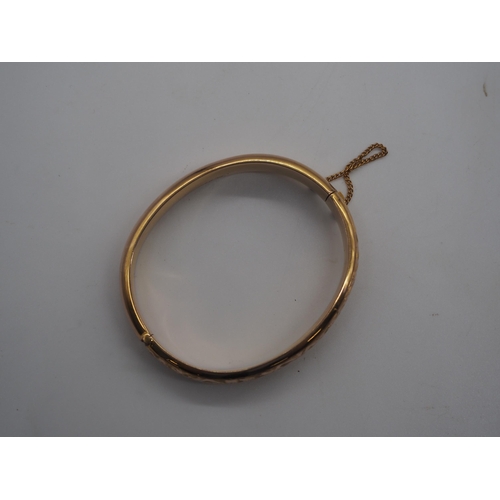 348C - 9ct Hallmarked hollow hinged bangle. 14.7g