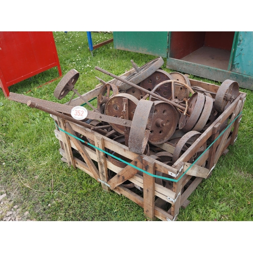 352 - Large quantity of cast iron wheels