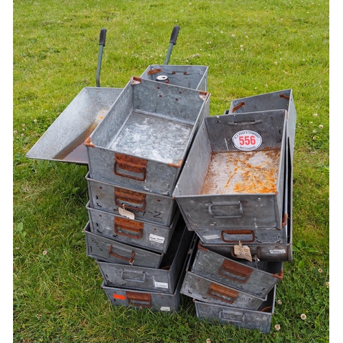 556 - Galvanised stacking boxes and wheelbarrow AF