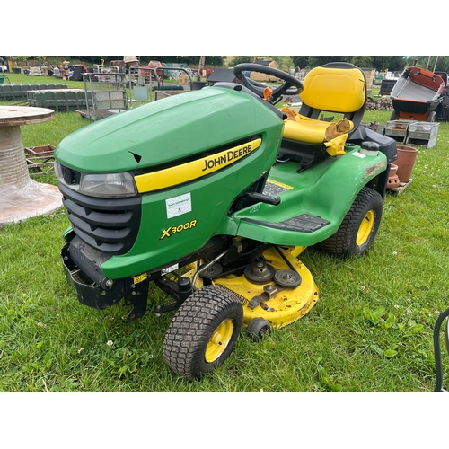 72A - John Deere X300R ride on mower with grass collector. Key in office