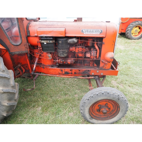 360 - Nuffield Universal Four tractor. With Winsam cab. Reg 585 DYA. Old buff logbook in office