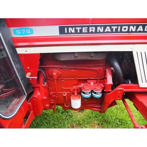 106 - International 574 tractor. Runs and drives. Fitted with pick up hitch. Showing 6985 Hours. Restored