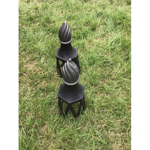 143 - Pair of cast iron post tops