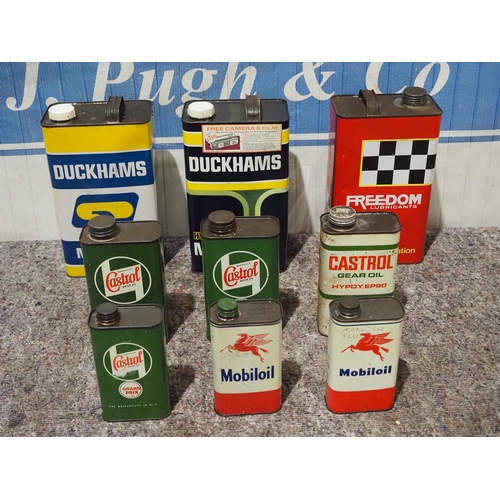 135 - Assorted oil cans to include Castrol and Mobiloil