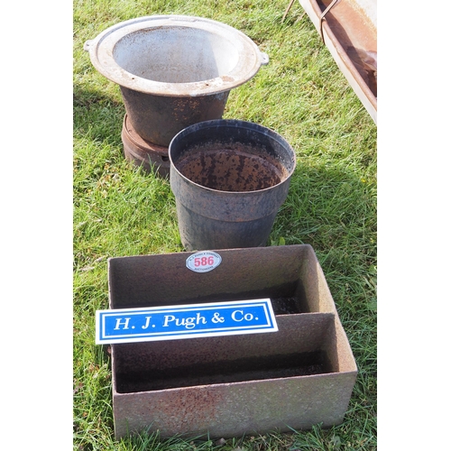 586 - Metal shelf and 2 cast iron cauldrons