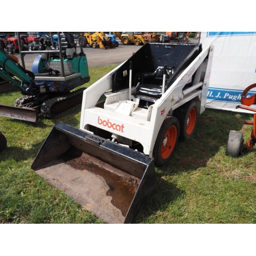 1527 - Bobcat 543 skid steer loader, engine runs. Wheel bearings need attention, slight oil leak. Sold as s... 