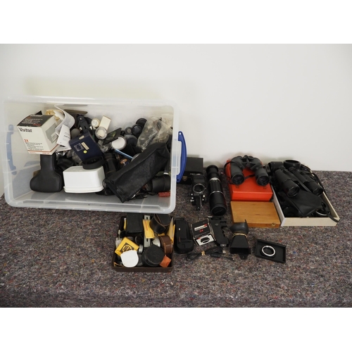 63 - Quantity of binoculars and assorted camera accessories to include lenses