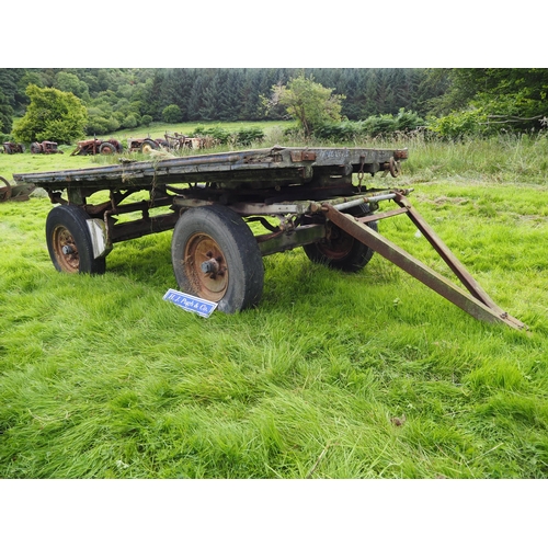 53 - 4 Wheel hay trailer on wooden frame