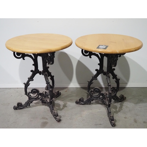 529 - Pair of round pub tables with cast iron bases - 2 H28