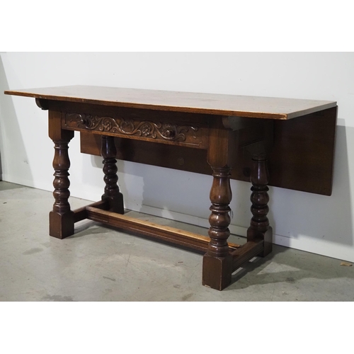 532 - Oak hall table with carved drawer and drop leaf back H28½