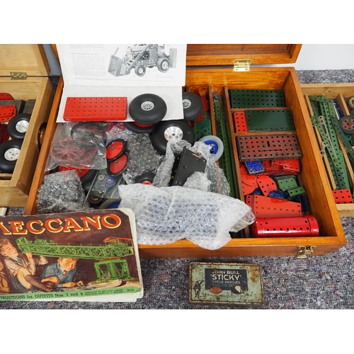 21 - Quantity of vintage Meccano to include wheels, motors, instructions books, etc.