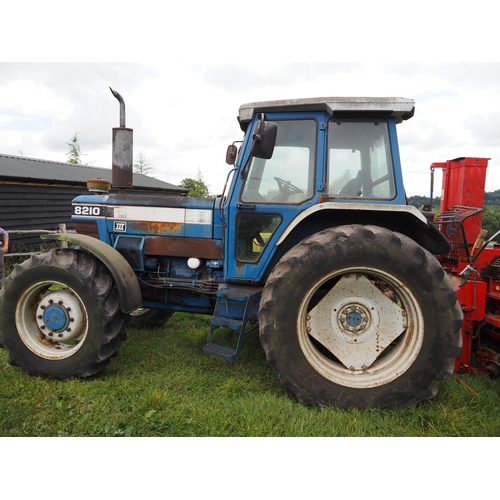 147 - Ford 8210 series 3 4wd tractor, showing 7214 hours, runs and drives. Reg. G356 NKK