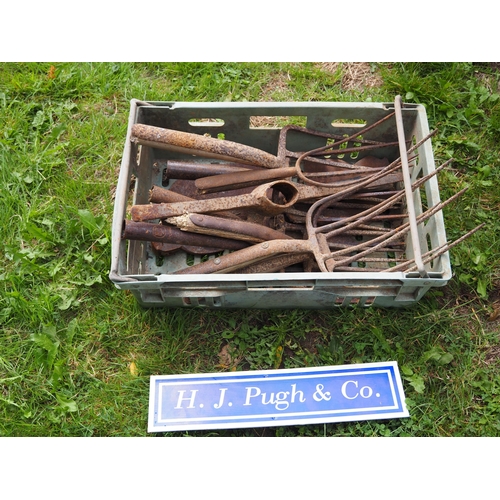 18 - Green tray containing forks, spades and pickaxe heads