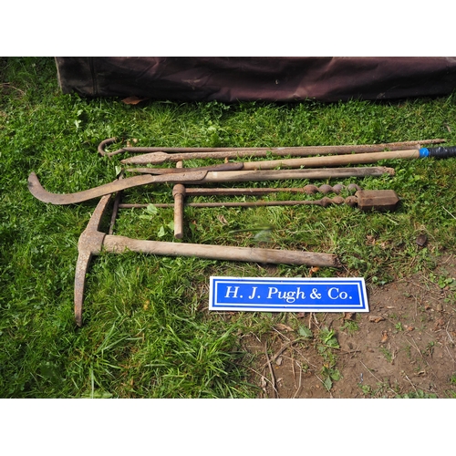 60 - Pick axe, long metal pin, stake dibbler, 2 slashing blades, handles and augers